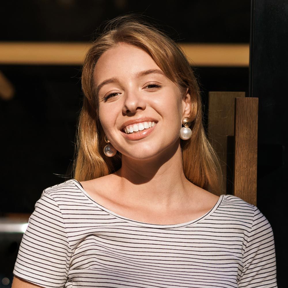Young woman smiling brightly