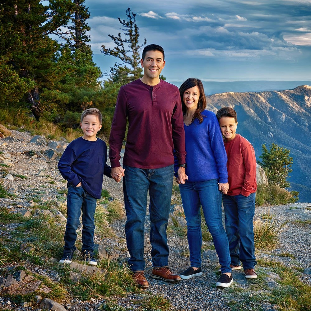 Dr. Adams with her husband and two young boys