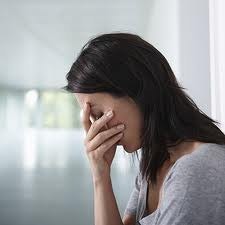 Woman showing signs of stress and jaw tension