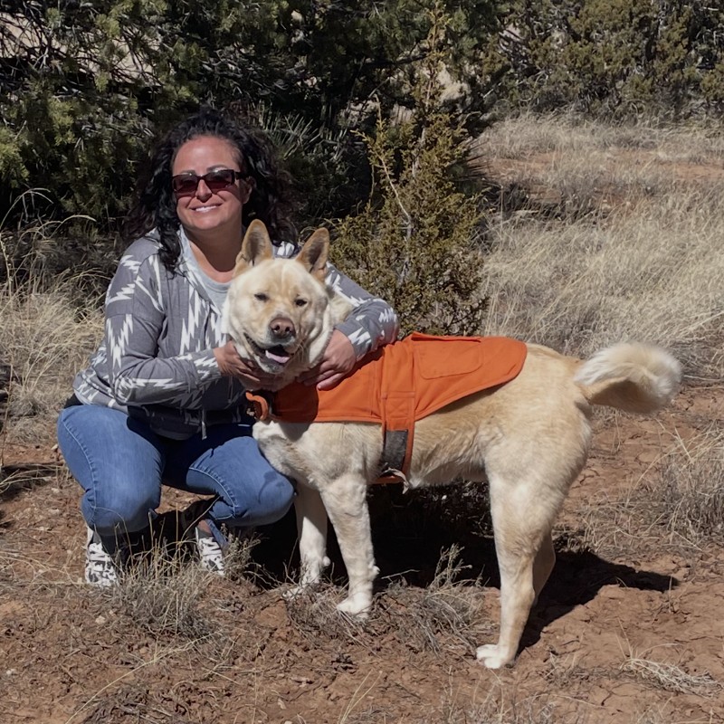 Freda Martinez, Patient Care Coordinator, outdoors with her dog